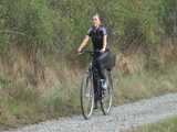 Watch Sandra riding her bike enjoying her shiny nylon Jumpsuit 8