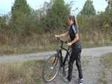 Watch Sandra riding her bike enjoying her shiny nylon Jumpsuit 9