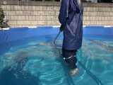 Watch Chloe cleaning the Pool in her shiny nylon Rainwear 7