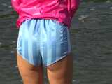 Watch Chloe enjoying her shiny nylon Shorts outside at a sunny Day 10