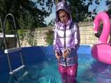 Watch Sandra enjoying her shiny nylon Downwear at a warm Summer Day in the Garden and in the Pool 8